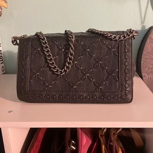 Black bag with gun metal chain with a faux letter strap